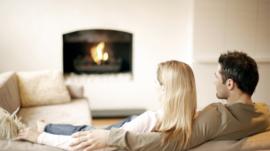 Couple sitting on sofa